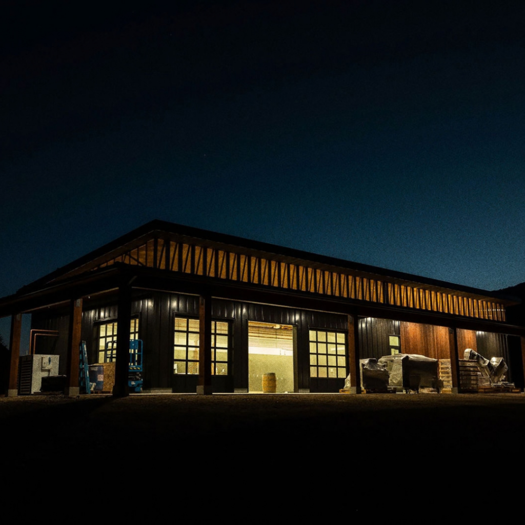 Large dim lit building under the night sky.