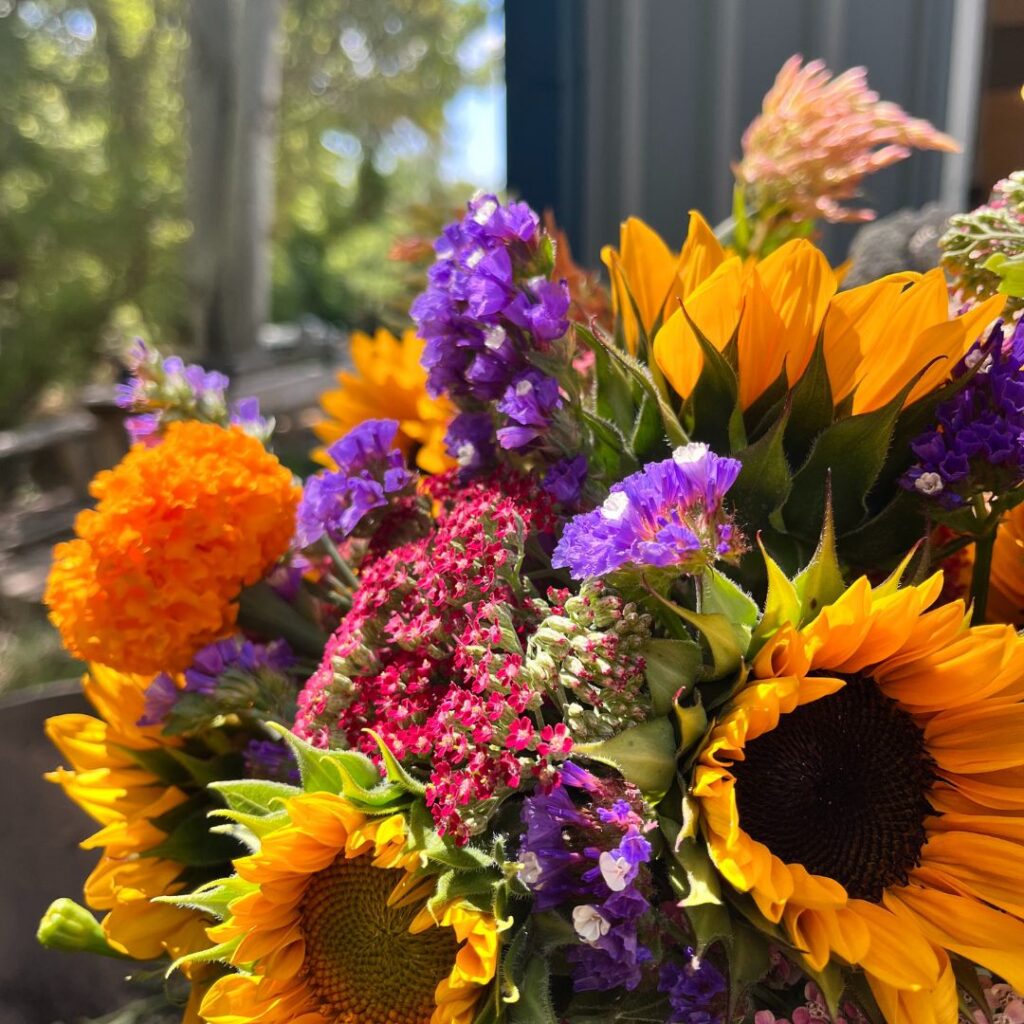 A vibrant, close-up bouquet featuring bright yellow
