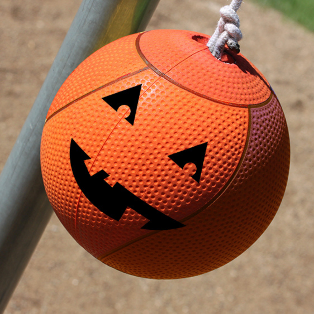 Orange tetherball with jack-o-lantern face